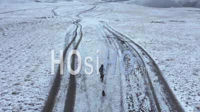 Woman Running In A Cold Morning Viewed From Drone