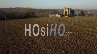Aerial View Of Agricultural Landscape And Ruined Castle In The Middle Of Fields At Sunrise - Video Drone Footage