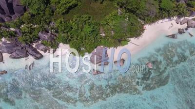 Overhead Aerial View Of Beautiful Source D'argent Beach In La Digue – Seychelles - Video Drone Footage