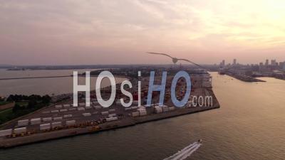 Boston Main Channel Panning Right With Shipyard Cityscape Airport Views At Sunset. Boston Massachusetts - Video Drone Footage