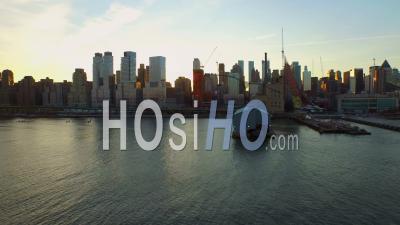 Nyc New York Usa Flying Low Over Hudson River Panning Left With Manhattan Cityscape Views At Sunrise - Video Drone Footage