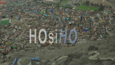Lima Peru Flying Down San Cristobal Hill Over Barrios Panning Up. - Video Drone Footage
