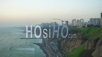 Lima Peru Flying Over Coastline Beach Panning With Cliff Site Parks And City Views. - Video Drone Footage