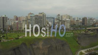 Lima Peru Flying Backwards Away From Cliff Side Parks And Paragliding Launch Area. - Video Drone Footage
