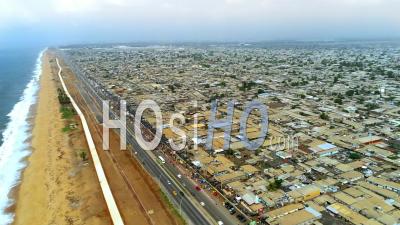 High On Bassam Highway And Market - Video Drone Footage