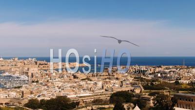 Aerial Approaching View Of The Towns Of Vittoriosa (birgu) And Valletta In Malta - Video Drone Footage