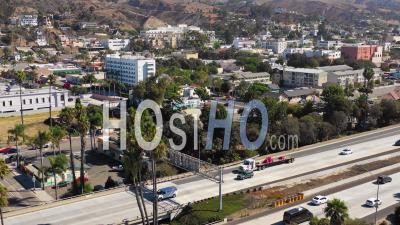 Aerial Video Drone Footage Of Southern California Beach Town Of Ventura, California With Freeway Foreground And Mountains Background