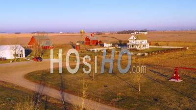 Aerial Video Drone Footage Over A Classic Farmhouse Farm And Barns In Rural Midwest America, York, Nebraska