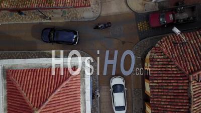 Aerial View Looking Straight Down Of A Red Tile Roofed Neighborhood And Streets In Bogota, Colombia - Video Drone Footage