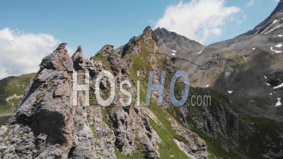 Alpine Landscapes With High Peaks And Green Pastures - Video Drone Footage