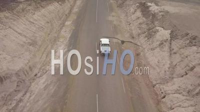 Aerial View Above A Pickup Truck Driving On A Coastal Road In Somalia Or Djibouti - Video Drone Footage