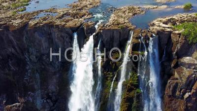 Aerial View Of Majestic Victoria Falls On The Zambezi River On The Border Of Zimbabwe And Zambia, Inspiration Of Africa - Video Drone Footage
