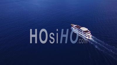 Aerial View Over A Large Yacht Traveling Along The Coastline Of Croatia - Video Drone Footage