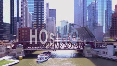 Aerial View Over An El Train Crossing The Chicago River In Downtown Chicago - Video Drone Footage