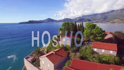 Aerial View Over The Beautiful Sveti Stefan Island In Montenegro - Video Drone Footage