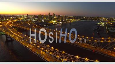 Beautiful Night Stationary Aerial View Of The Crescent City Bridge Over The Mississippi River Revealing The New Orleans Louisiana Skyline - Video Drone Footage