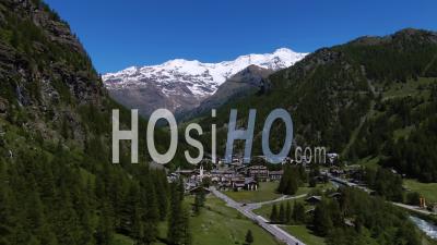 The Sky Resort Village Of Gressoney La Trinite In The Italian Alps, With Mount Rosa In The Background - Video Drone Footage