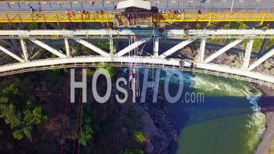 Aerial View Of A Man Bungee Jump Off A Bridge In Zambia Zimbawbwe Africa - Video Drone Footage