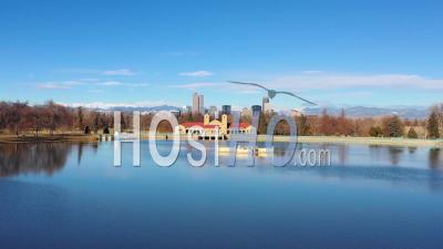 Aerial View Of Downtown Denver Colorado Skyline From Large Lake At City Park - Video Drone Footage