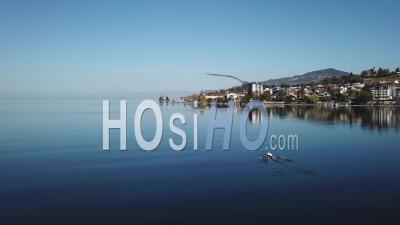 Two Rowers On Lake Geneva In The Morning - Video Drone Footage