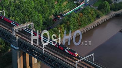 Aerial View Of Fast Train, Passing Bridge, Newcastle Upon Tyne, United Kingdom - Video Drone Footage
