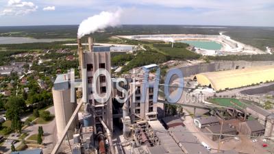 Chimney Emits Heavy Smoke On Heavy Industrial Cement Factory, Gotland Sweden - Video Drone Footage