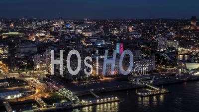 Establishing Aerial View Of Liverpool At Night, City Waterfront, United Kingdom - Video Drone Footage
