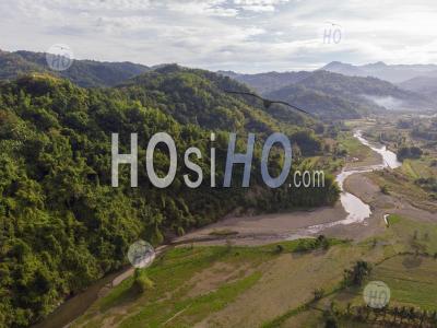 Jungle Covered Mountain Side With River, Philippines - Aerial Photography