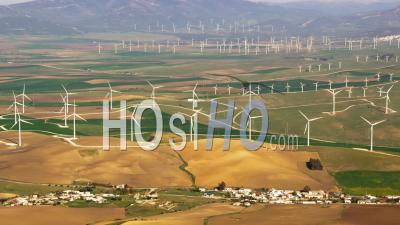 Aerial View Of (wide Shot) Wind Farm With Wind Turbines And Fields