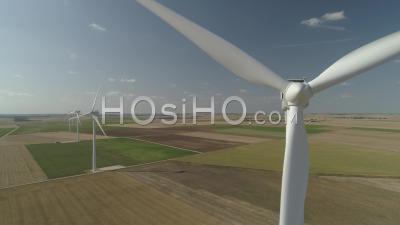 Rotating Wind Turbines And Wind Farm In Ile-De-France, Seine-Et-Marne, France, Video Drone Footage