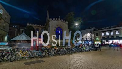 Cambridge At Night With People Parking Bicycles