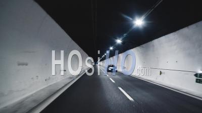 Cars Driving On A Highway Tunnel At Night