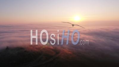 Mont Saint Michel De Braspart At Frozen Sunrise, Clouds And Sun. - Video Drone Footage