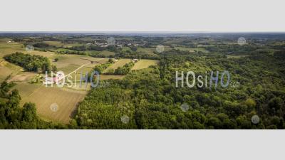 Aerial Of Flying Over A Beautiful Green Forest In A Rural Landscape - Aerial Photography