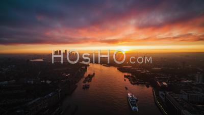 Aerial View Of London Canary Wharf Business District In The Horizon Amazing Sunrise United Kingdom - Video Drone Footage