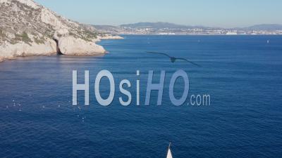 Sailing Boat Along The Calanques Of Marseille, Blue Coast Area - Video Drone Footage