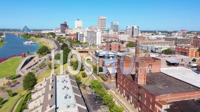 Mixed Use Industrial District Of Memphis Tennessee With Apartments, Condos And Converted Old Warehouses. Downtown City, Pyramid And Bridge Background - Aerial Video By Drone