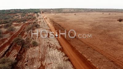 Cars Traveling On A Generic Rural Dirt Road On Molokai, Hawaii From Maunaloa To Hale O Lono - Aerial Video By Drone