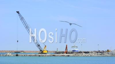 Time Lapse, Crane Moving Rocks On Harbor Construction Site