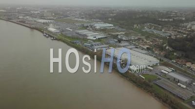 An Industrial Area Near A River - Video Drone Footage