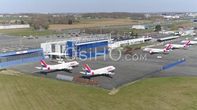 Lille Lesquin Airport Hosting A Complete Fleet Of Hop Airliners In Front Of A Close Terminal - Video Drone Footage