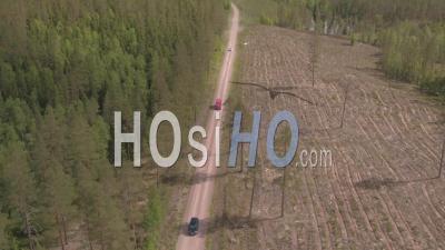 Three Cars Driving On A Track In The Middle Of A Forest, Tackasen, Sweden - Video Drone Footage