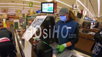 2020 - Grocery Store Supermarket Checkout Workers Are Essential During The Coronavirus Covid-19 Epidemic Outbreak.