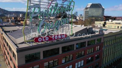 Rising Aerial Reveals Portland Oregon Stag Deer Sign And Downtown Cityscape And Business District. - Video Drone Footage