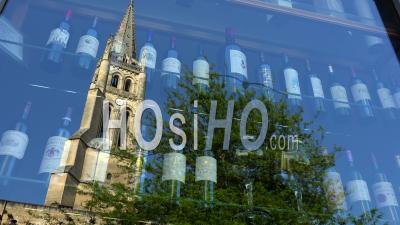 Shop Window Of A Wine Bottle Store And Reflection Of The Bell Tower Of Saint-Emilion City