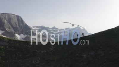 Mountaineers On A Ridge In Front Of Gavarnie Circus At Sunset Viewed By Drone
