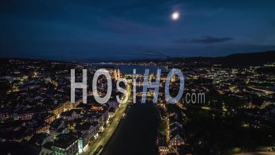 Aerial View Shot Of Zurich, Wide Establishing At Night Evening, Old Town, Switzerland - Video Drone Footage