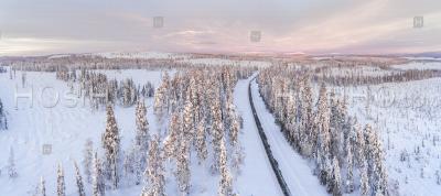 Aerial Of Bad Driving Conditions On Dangerous Icy Roads In Slippery, Cold Weather Winter Scenery In Lapland, Finland, Europe - Aerial Photography