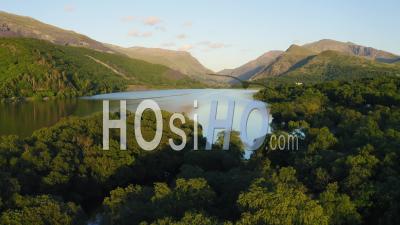 Beautiful Landscape Of Llyn Padarn Lake Surrounded By Lush Forest And Mountains In Snowdonia National Park, Wales - Video Drone Footage