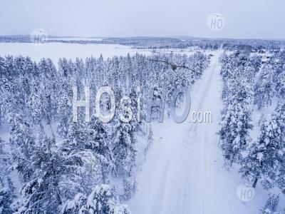 Dangerous Road Conditions Of Icy Snow Covered Winter Road In The Arctic Circle In Lapland, Finland Drone